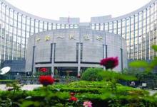 央行調整人民幣兌美元匯率(圖)